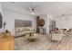 Comfortable living room with neutral tones, modern furniture, and ample natural light at 20301 N Queen Palm Ln, Surprise, AZ 85374