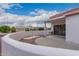 Relaxing covered patio space with neutral colors, perfect for enjoying outdoor living at 20301 N Queen Palm Ln, Surprise, AZ 85374