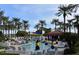Resort-style community pool featuring seating and shade, perfect for relaxing by the water at 20301 N Queen Palm Ln, Surprise, AZ 85374