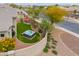 Backyard features a hot tub, an outdoor dining table and artificial grass at 20583 N Ryans Trl, Maricopa, AZ 85138