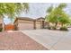 Wide driveway, desert landscaping, and well-maintained exterior enhance this home's curb appeal at 20583 N Ryans Trl, Maricopa, AZ 85138
