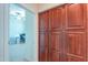 Hallway with large storage cabinet, leading into a carpeted office space at 20583 N Ryans Trl, Maricopa, AZ 85138