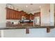 Kitchen featuring dark cabinets, granite countertops, and stainless steel appliances at 20583 N Ryans Trl, Maricopa, AZ 85138