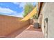 Side yard with crushed gravel and AC unit, shaded with an awning at 20583 N Ryans Trl, Maricopa, AZ 85138