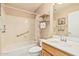 Bright bathroom featuring a tub and shower combination with a vanity sink at 21819 N 48Th St, Phoenix, AZ 85054