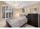 Cozy bedroom with a ceiling fan, a large window, and modern decor at 21819 N 48Th St, Phoenix, AZ 85054