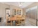 Charming dining room featuring a wooden table, display cabinet, and neutral decor at 21819 N 48Th St, Phoenix, AZ 85054