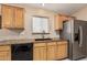 Stylish kitchen featuring granite counters, wood cabinetry, and stainless steel appliances at 21819 N 48Th St, Phoenix, AZ 85054