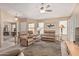 Open living room with neutral paint, ceiling fan, and carpet at 21819 N 48Th St, Phoenix, AZ 85054
