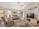 Bright living room featuring comfortable seating and a ceiling fan at 21819 N 48Th St, Phoenix, AZ 85054
