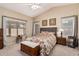 Inviting primary bedroom with vaulted ceiling, a floral bedspread, and bright windows at 21819 N 48Th St, Phoenix, AZ 85054
