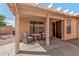 Enjoy outdoor living on this covered patio with cozy seating, perfect for relaxation at 21819 N 48Th St, Phoenix, AZ 85054