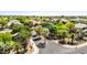 Beautiful aerial view of a serene, tree-lined neighborhood with well-manicured lawns and landscaped streets and sidewalks at 2476 E Marlene Dr, Gilbert, AZ 85296