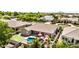 Backyard with a refreshing pool, comfortable patio seating, and a lush putting green, creating an ideal outdoor retreat at 2476 E Marlene Dr, Gilbert, AZ 85296