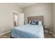 Cozy bedroom featuring a neutral color scheme and adjacent doorway at 2476 E Marlene Dr, Gilbert, AZ 85296