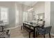 Dining room featuring a dark wood table and chairs with modern lighting fixtures at 2476 E Marlene Dr, Gilbert, AZ 85296