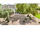 Entrance to Greenfield Estates featuring stone accents and mature trees, creating an inviting and prestigious community entry at 2476 E Marlene Dr, Gilbert, AZ 85296