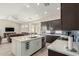 Bright, open kitchen layout featuring stainless steel appliances and a large island with seating at 2476 E Marlene Dr, Gilbert, AZ 85296