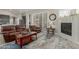 Inviting living room features fireplace, plantation shutters, and comfortable seating at 2476 E Marlene Dr, Gilbert, AZ 85296