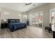 Spacious main bedroom with a blue bedspread, natural light and patio access through shuttered doors at 2476 E Marlene Dr, Gilbert, AZ 85296