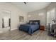 Main bedroom featuring a blue bedspread, natural light, and modern décor at 2476 E Marlene Dr, Gilbert, AZ 85296