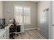Comfortable home office featuring a bright window with shutters and modern flooring at 2476 E Marlene Dr, Gilbert, AZ 85296