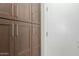 Ample storage space with dark wood cabinets and white doors at 2476 E Marlene Dr, Gilbert, AZ 85296