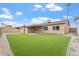 Exterior view of home highlighting the backyard, patio, and well-maintained lawn at 2741 E Sweetwater Ave, Phoenix, AZ 85032