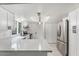Bright kitchen showcasing white cabinets, updated countertops, and stainless steel appliances at 2741 E Sweetwater Ave, Phoenix, AZ 85032