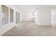 Spacious living area with sleek tile flooring, large windows, and seamless access to outdoor spaces at 2741 E Sweetwater Ave, Phoenix, AZ 85032