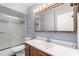 Bathroom featuring a shower, toilet, vanity and mirror at 2816 S Don Luis Cir, Mesa, AZ 85202