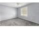 Comfortable bedroom with carpet and plenty of natural light streaming through the window at 2816 S Don Luis Cir, Mesa, AZ 85202