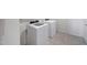 Laundry room features a washer and dryer with tile flooring at 30683 W Amelia Ave, Buckeye, AZ 85396
