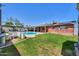 Spacious backyard featuring a refreshing pool, lush greenery and ample space at 3413 W Ocotillo Rd, Phoenix, AZ 85017