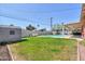 Large backyard showcasing pool, shed, and lush lawn at 3413 W Ocotillo Rd, Phoenix, AZ 85017