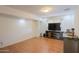Finished basement area with laminate flooring and entertainment center at 3413 W Ocotillo Rd, Phoenix, AZ 85017