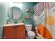 Bathroom with decorative shower curtain, vanity, and plenty of storage at 3413 W Ocotillo Rd, Phoenix, AZ 85017