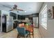 Updated kitchen with stainless steel appliances, stylish cabinets, and tile backsplash at 3413 W Ocotillo Rd, Phoenix, AZ 85017