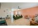 Inviting living room with tile flooring, complemented by stylish furniture and ample natural light at 3413 W Ocotillo Rd, Phoenix, AZ 85017