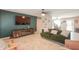 Comfortable living room with tile flooring, featuring stylish furniture and modern entertainment setup at 3413 W Ocotillo Rd, Phoenix, AZ 85017