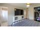 Bedroom with a TV, closet, and bathroom access at 3413 W Ocotillo Rd, Phoenix, AZ 85017