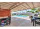 Covered patio area perfect for entertaining with swimming pool views at 3413 W Ocotillo Rd, Phoenix, AZ 85017
