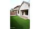 Backyard featuring an artificial grass and a patio at 3435 E Amber Ln, Gilbert, AZ 85296