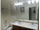 Bathroom with a double sink vanity, tile floor, and shower-tub combination at 3435 E Amber Ln, Gilbert, AZ 85296