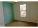 Bedroom with large window and natural light highlighting the carpet floors at 3435 E Amber Ln, Gilbert, AZ 85296
