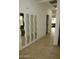 Hallway with mirrors and light tile floor at 3435 E Amber Ln, Gilbert, AZ 85296