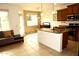 Bright, open kitchen with granite countertops, tile floors, stainless appliances, and ample cabinet space at 3435 E Amber Ln, Gilbert, AZ 85296