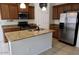 Well-appointed kitchen featuring granite countertops, stainless steel appliances, and a central island at 3435 E Amber Ln, Gilbert, AZ 85296
