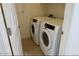 Bright laundry room features Samsung washer and dryer, and ceramic tile flooring at 3435 E Amber Ln, Gilbert, AZ 85296