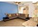 Comfortable living area with tile flooring, ceiling fan, and neutral blue walls at 3435 E Amber Ln, Gilbert, AZ 85296